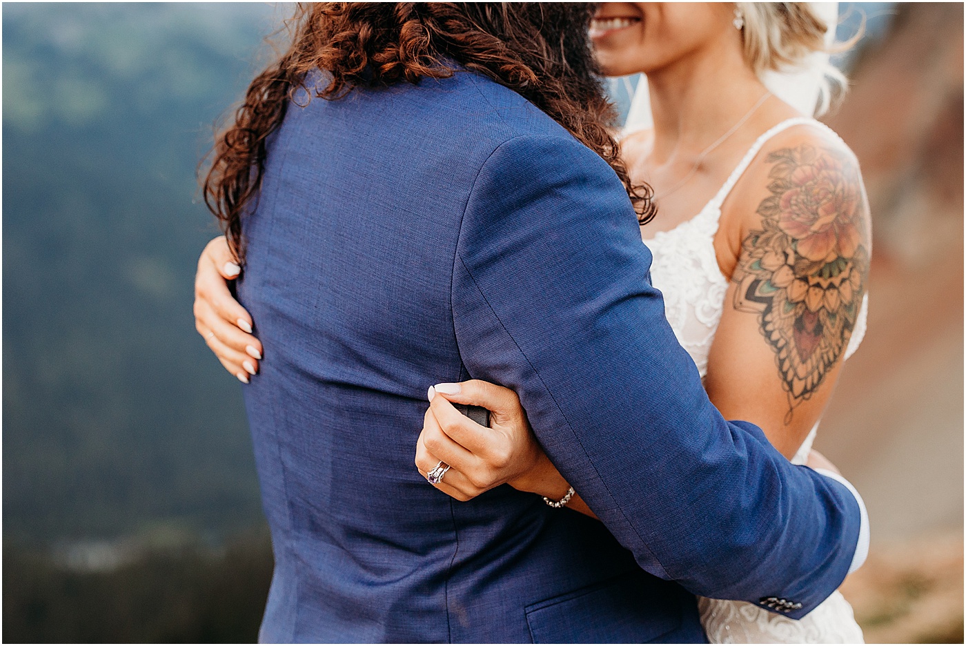 Newlyweds embracing after elopement | Photo by Megan Montalvo Photography