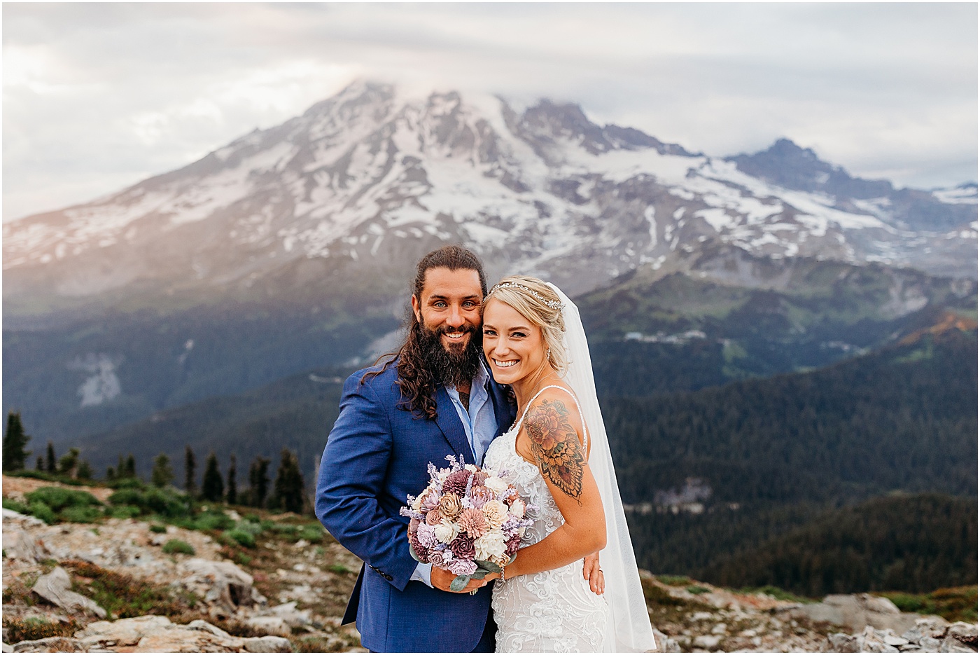 Bride and groom portraits with a view of Mount Rainier | Photo by Megan Montalvo Photography