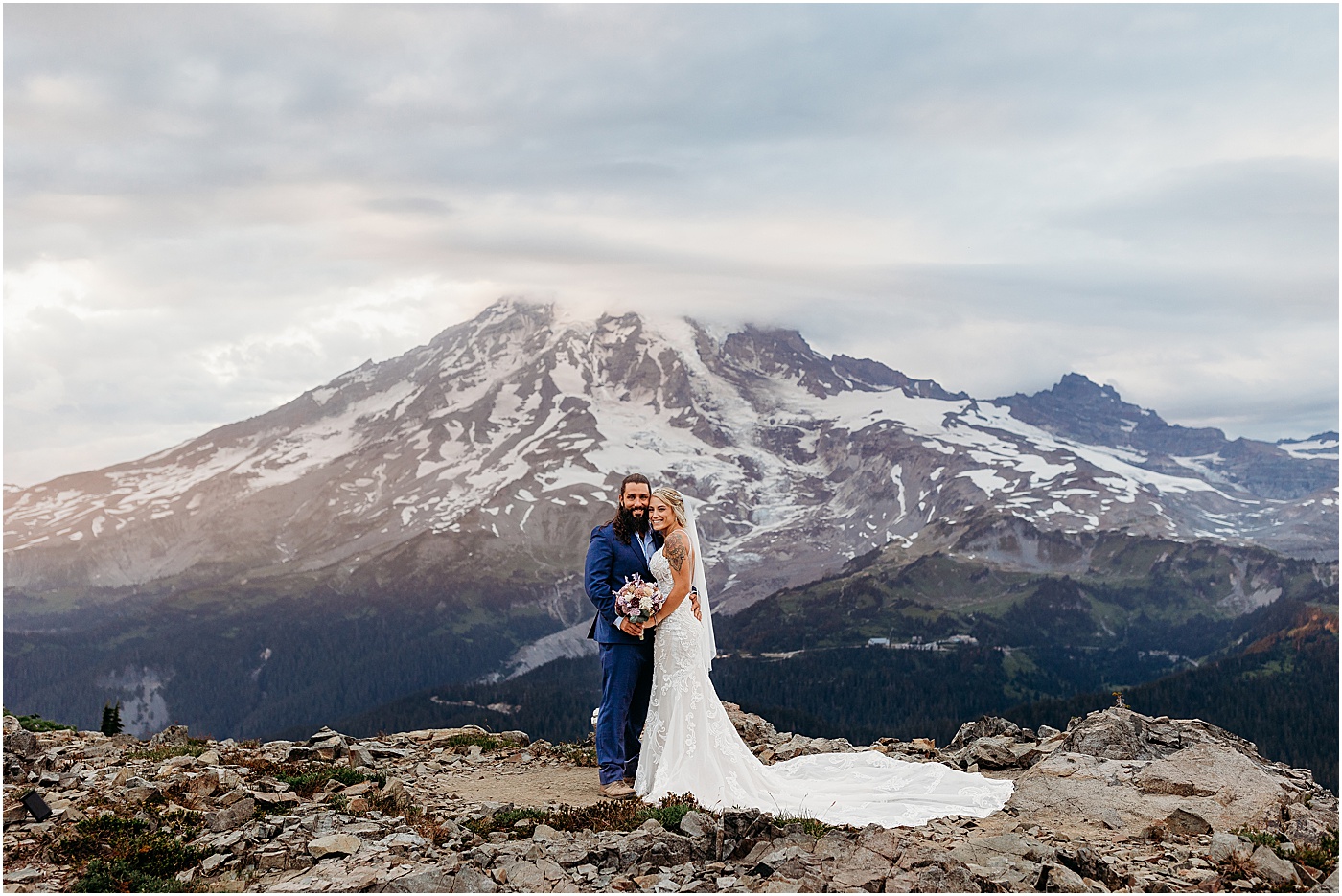 Bride and groom portraits with a view of Mount Rainier | Photo by Megan Montalvo Photography