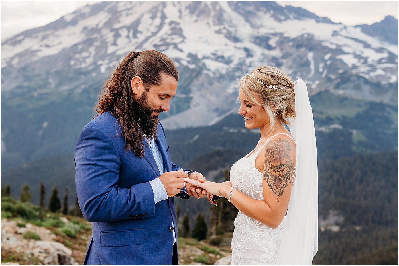 Groom putting ring on bride's finger | Photo by Megan Montalvo Photography