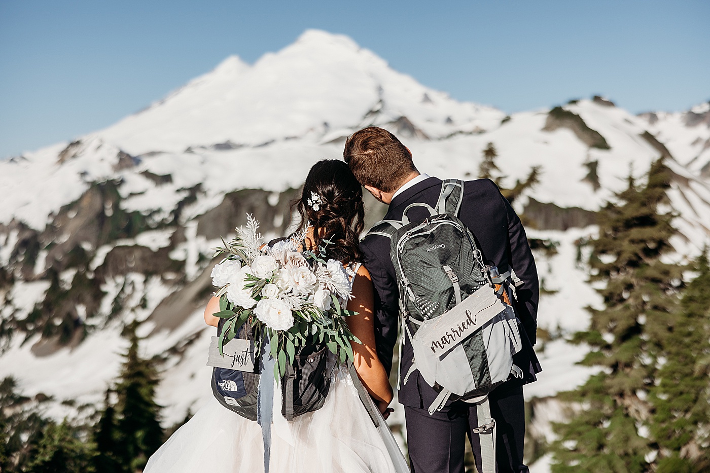 Bride and groom with just married signs at Mount Baker | Megan Montalvo Photography