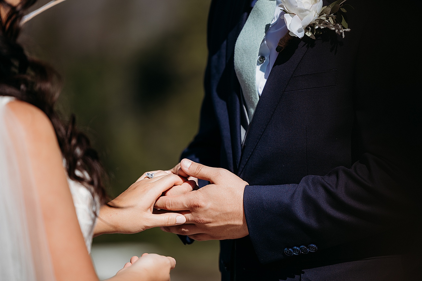 Brdie and groom exchanging rings | Megan Montalvo Photography
