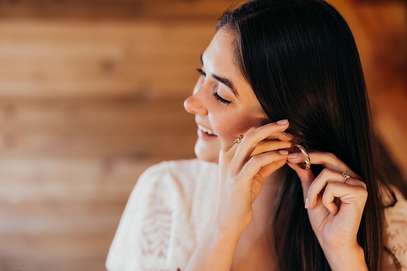 Bride putting in earrings | Megan Montalvo Photography