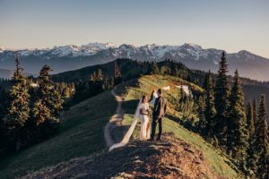 Couple standing on top of a ridge in the Olympic National Park