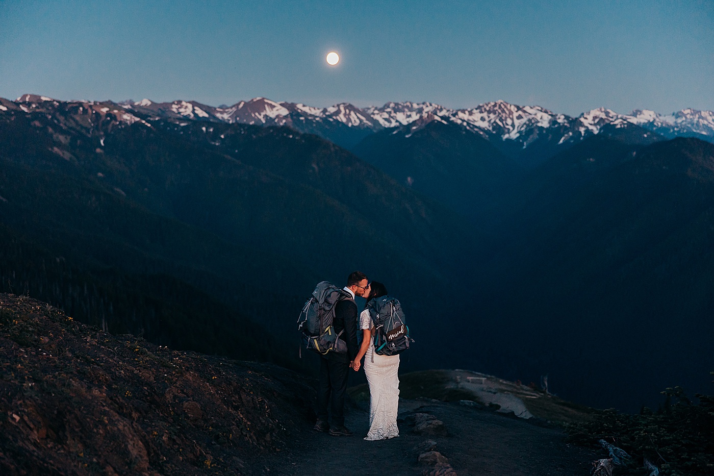 Bride and groom kissing under moonlight at Hurricane Ridge elopement | Megan Montalvo Photography