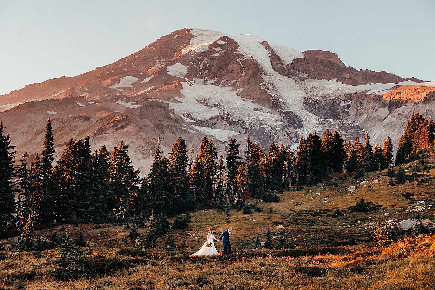 Couple walking through Mt Rainier and blog post about why you should elope in the fall | Megan Montalvo Photography