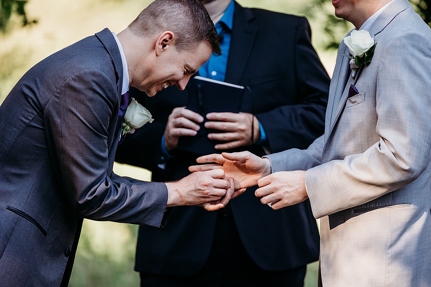 Groom laughing as he places wedding ring | Megan Montalvo Photography