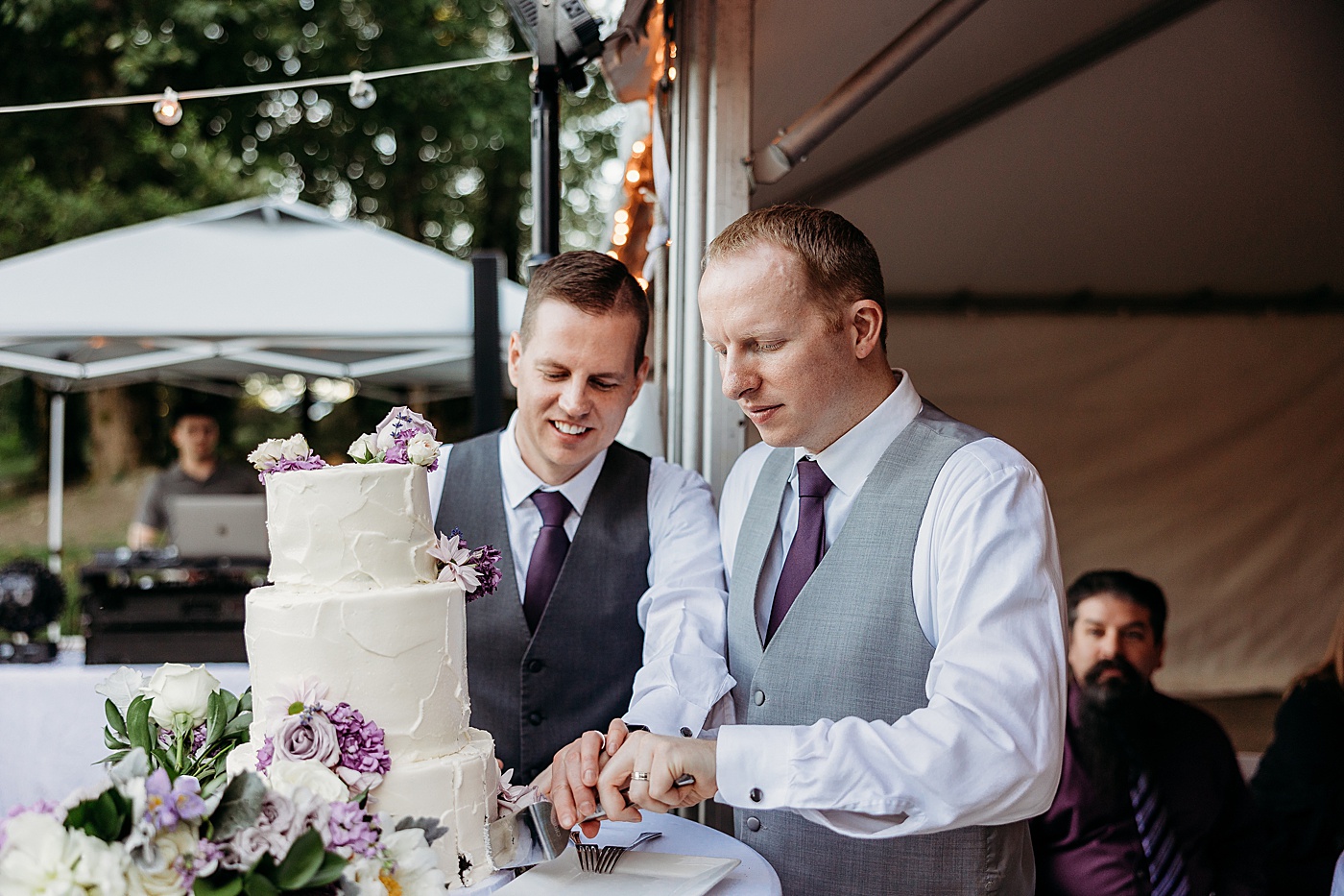 Grooms cutting wedding cake | Megan Montalvo Photography