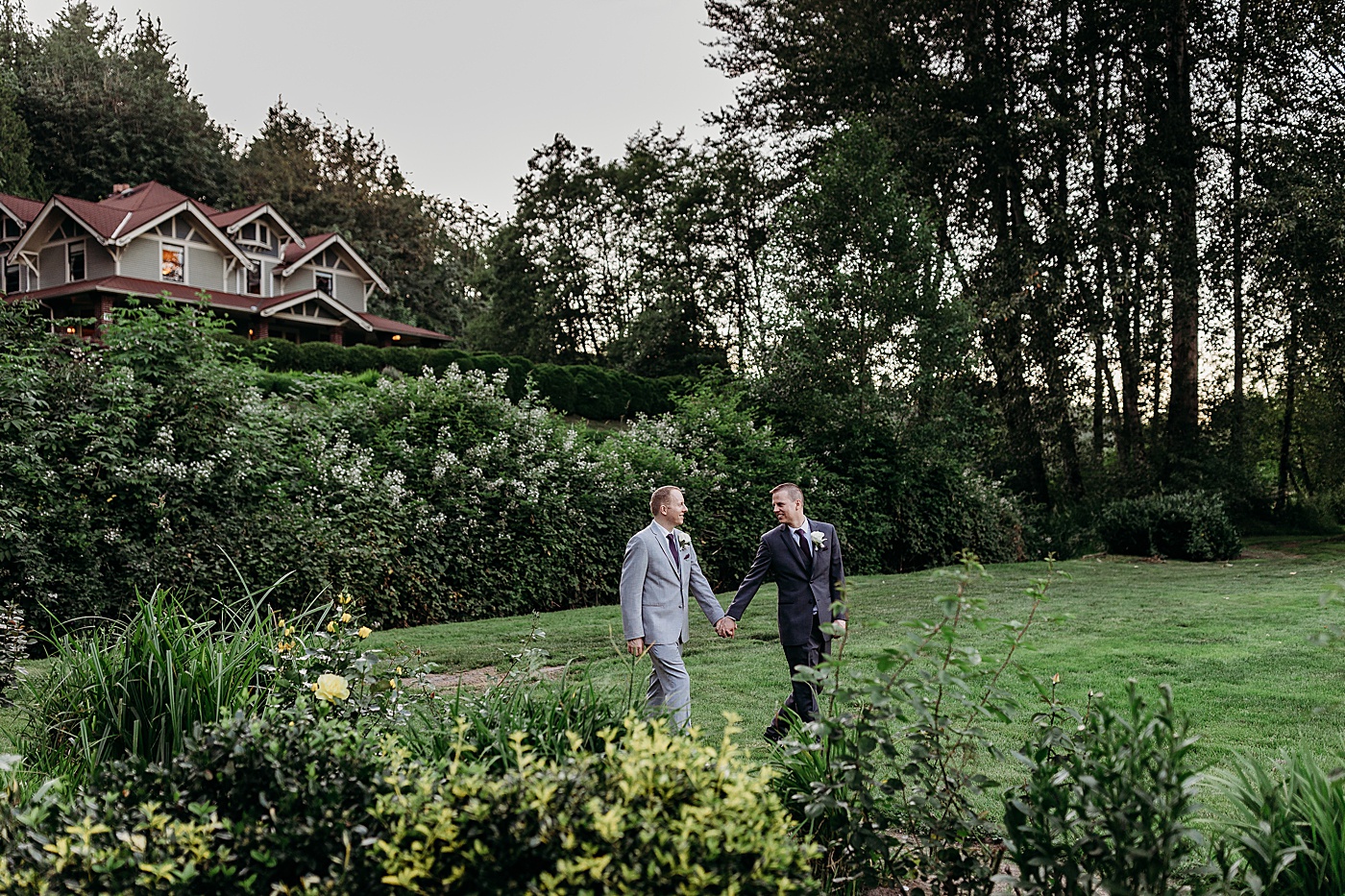 Same-sex couple walking through gardens at Sanders Estate | Megan Montalvo Photography