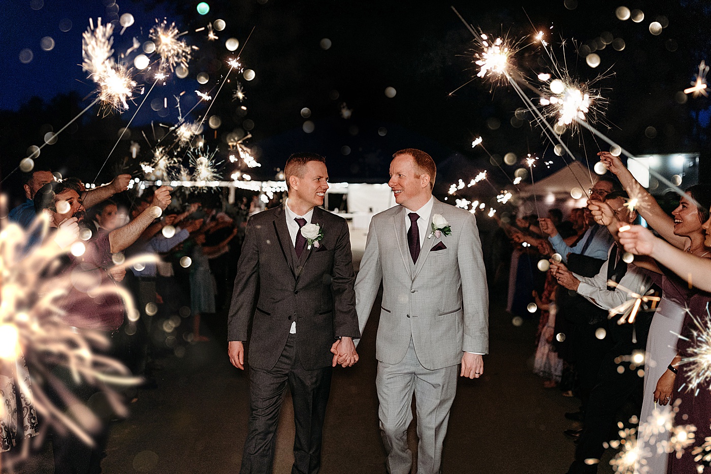 Sparkler exit for same-sex wedding at Washington state intimate wedding venue, Sanders Estate | Megan Montalvo Photography