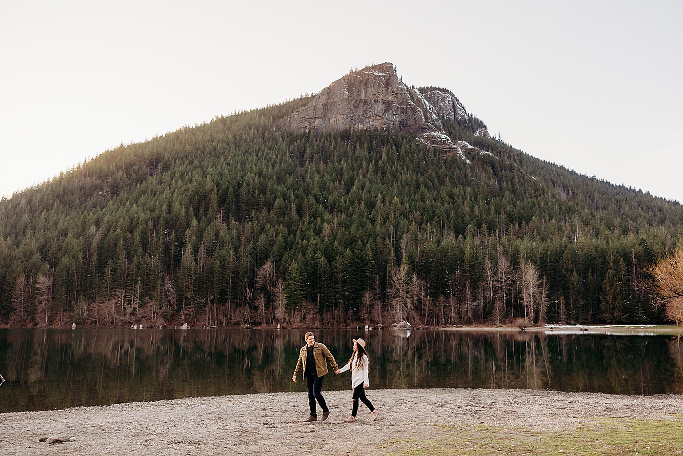 Engaged couple walking together along the water at Rattlesnake Lake | Megan Montalvo Photography
