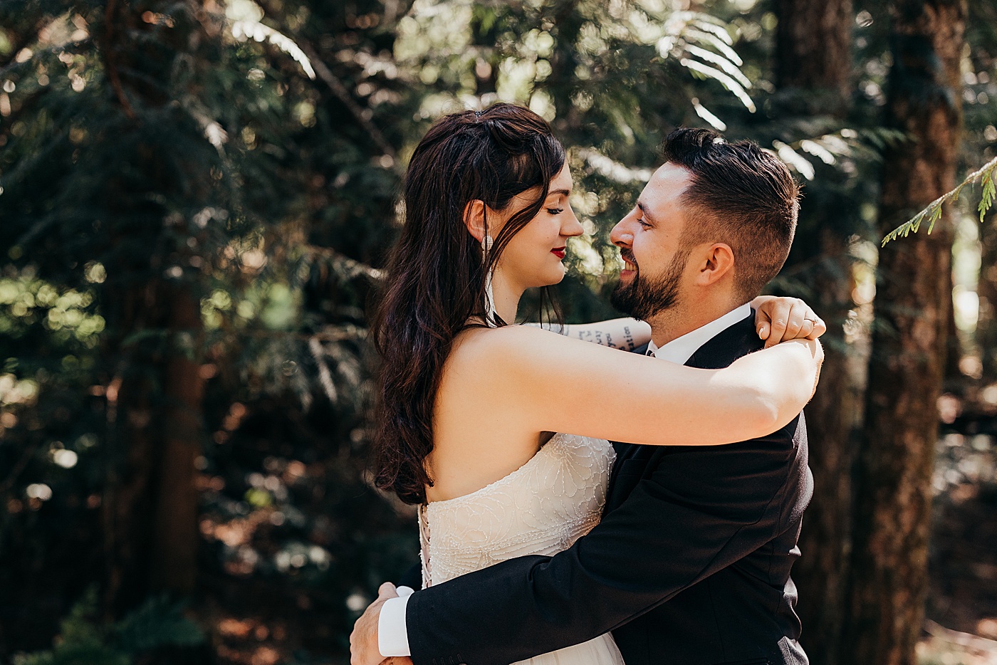 Bride and groom hugging | Photo by Megan Montalvo Photography