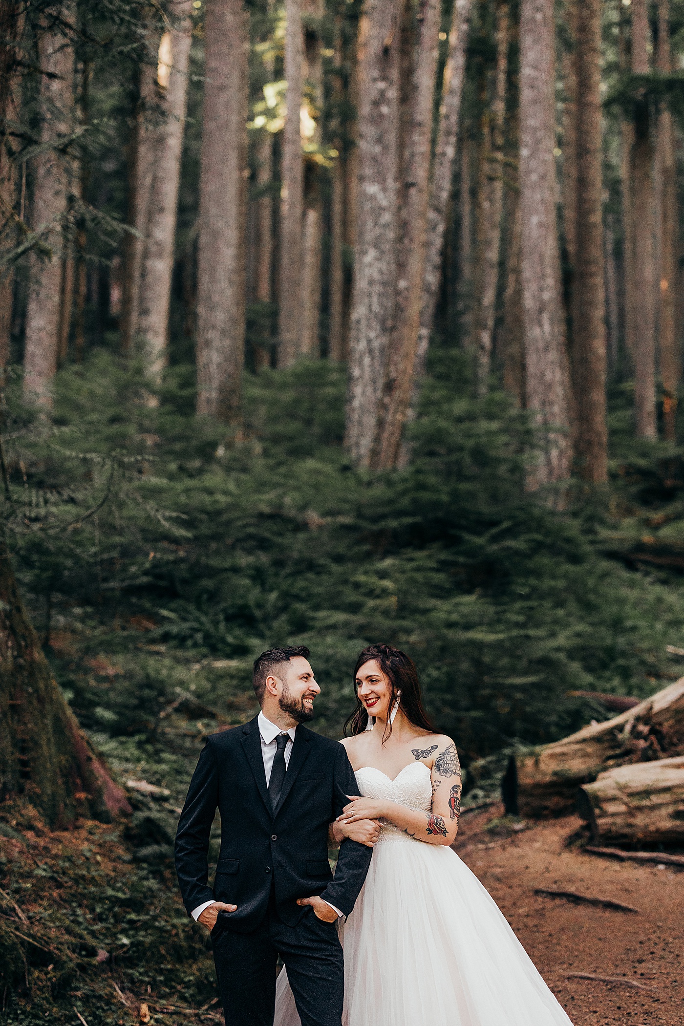 Bride and groom portraits in the forest in Mt. Rainier National Park | Photo by Megan Montalvo Photography
