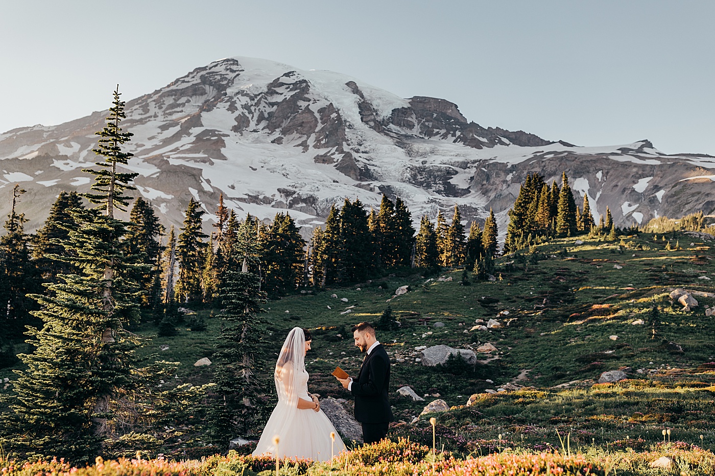 Intimate vow exchange at Mount Rainier | Photo by Megan Montalvo Photography