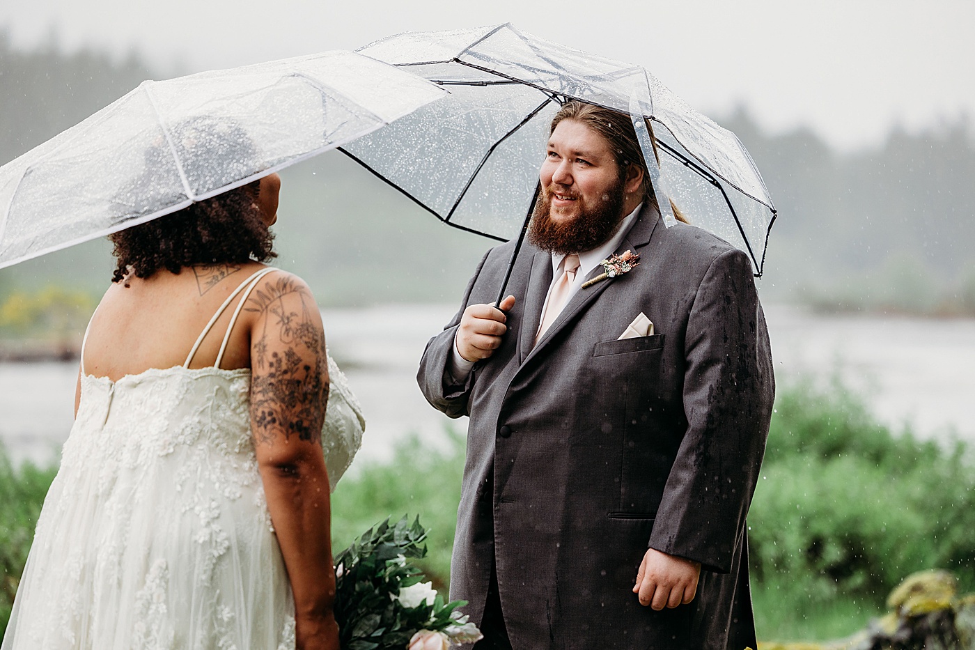 Bride and groom first look in the rain | Photo by Megan Montalvo Photography