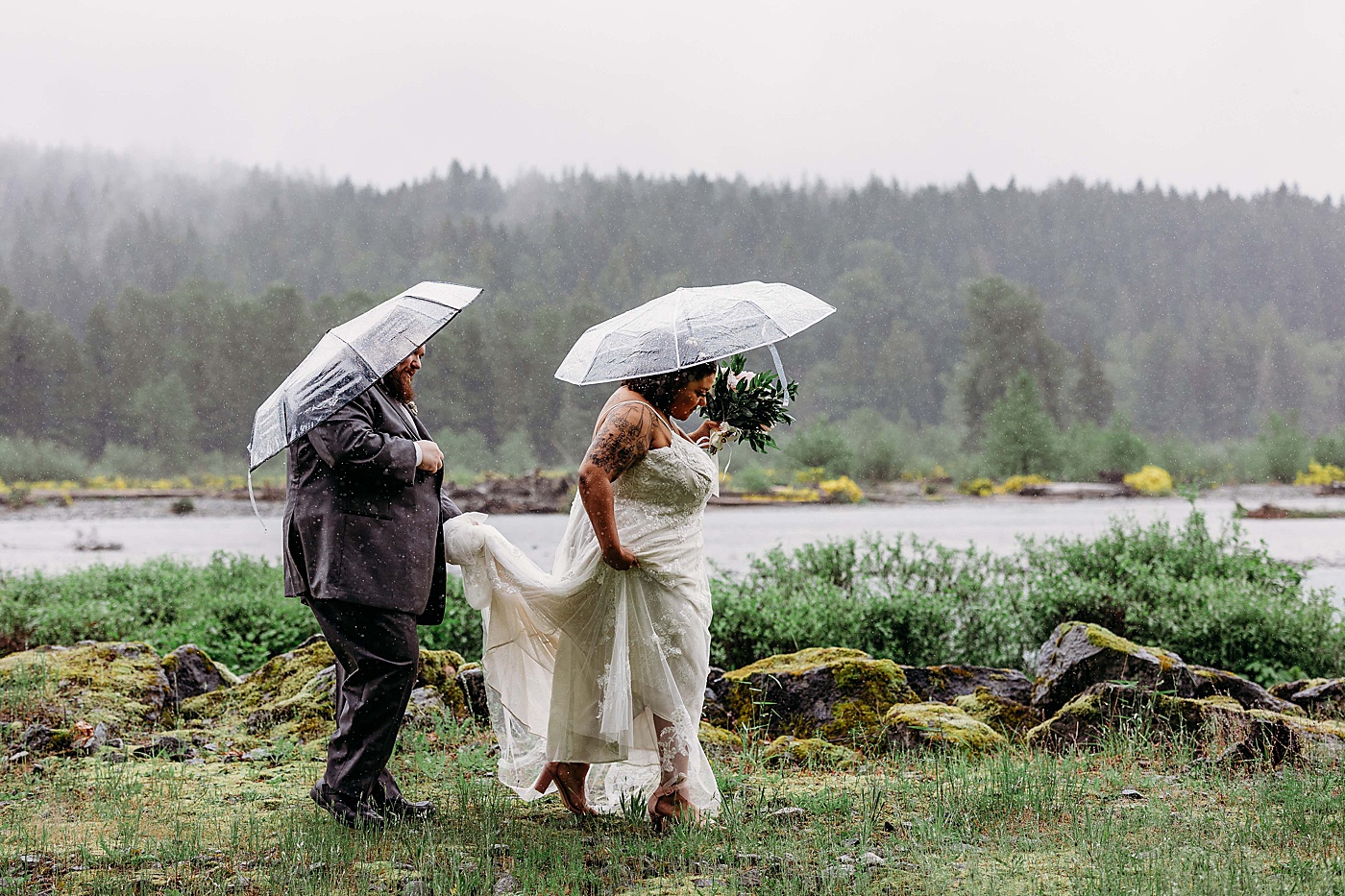 Bride and groom portraits in the rain along the Cowlitz River | Photo by Megan Montalvo Photography