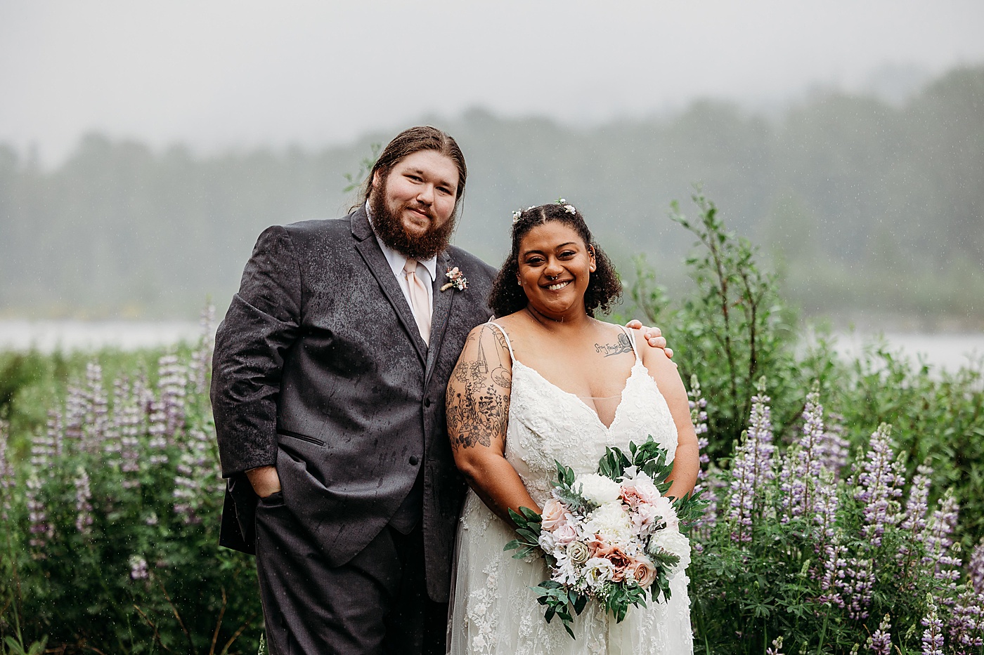 Bride and groom portraits in the rain during intimate elopement | Photo by Megan Montalvo Photography
