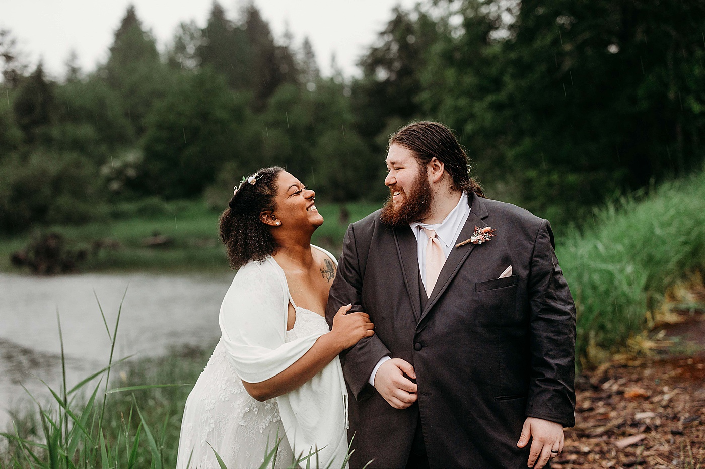 Bride and groom smiling at each other | Photo by Megan Montalvo Photography