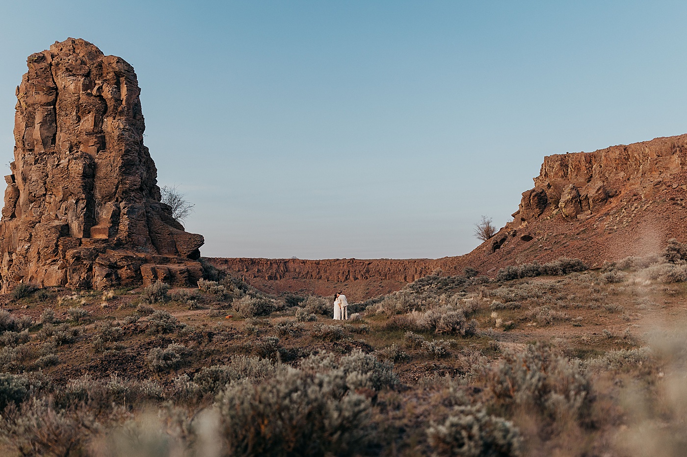 Bride and groom at desert destination elopement at Vantage in Central Washington | Photo by Megan Montalvo Photography
