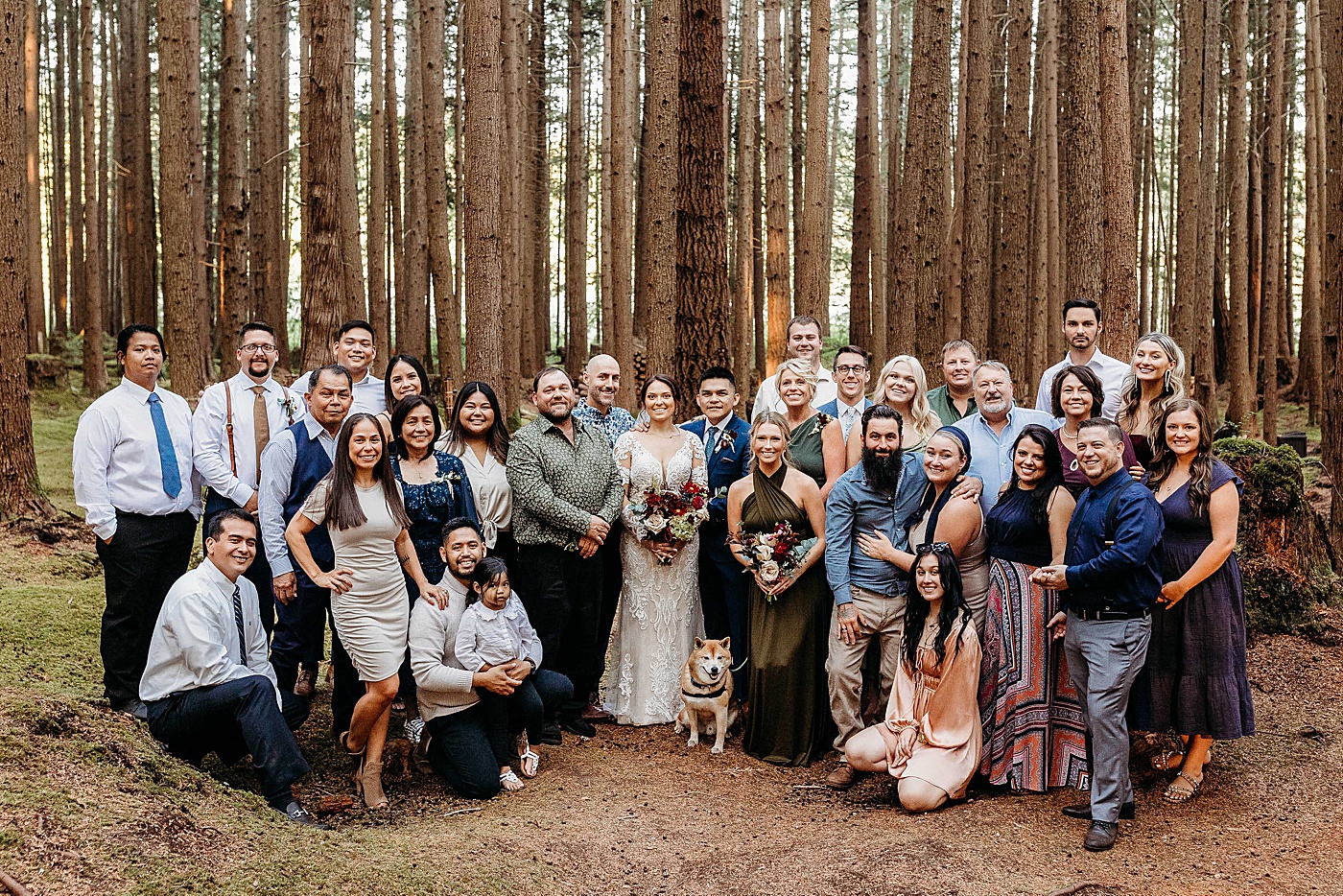 Bride and groom with immediate friends and family during intimate wedding at Emerald Forest | Photo by Megan Montalvo Photography