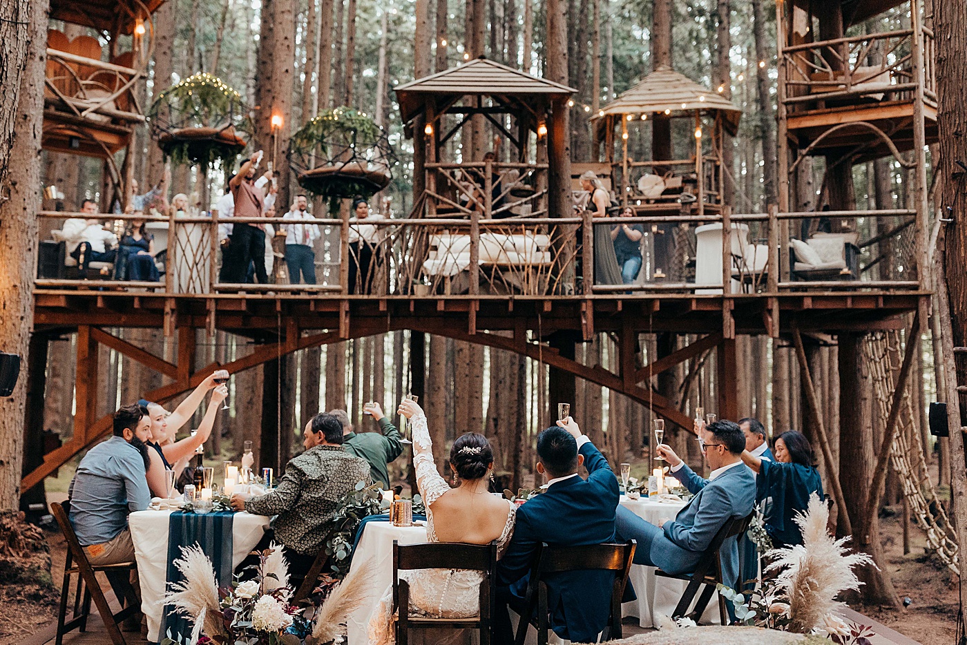 Toasts during reception at Emerald Forest Treehouse | Photo by Megan Montalvo Photography