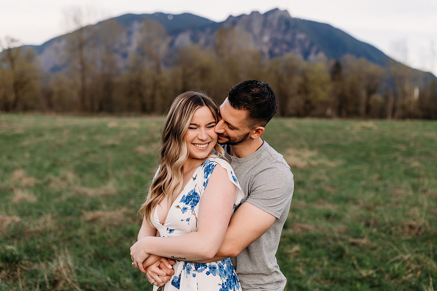 Couple hugging and laughing during engagement photoshoot | Photo by Megan Montalvo Photography