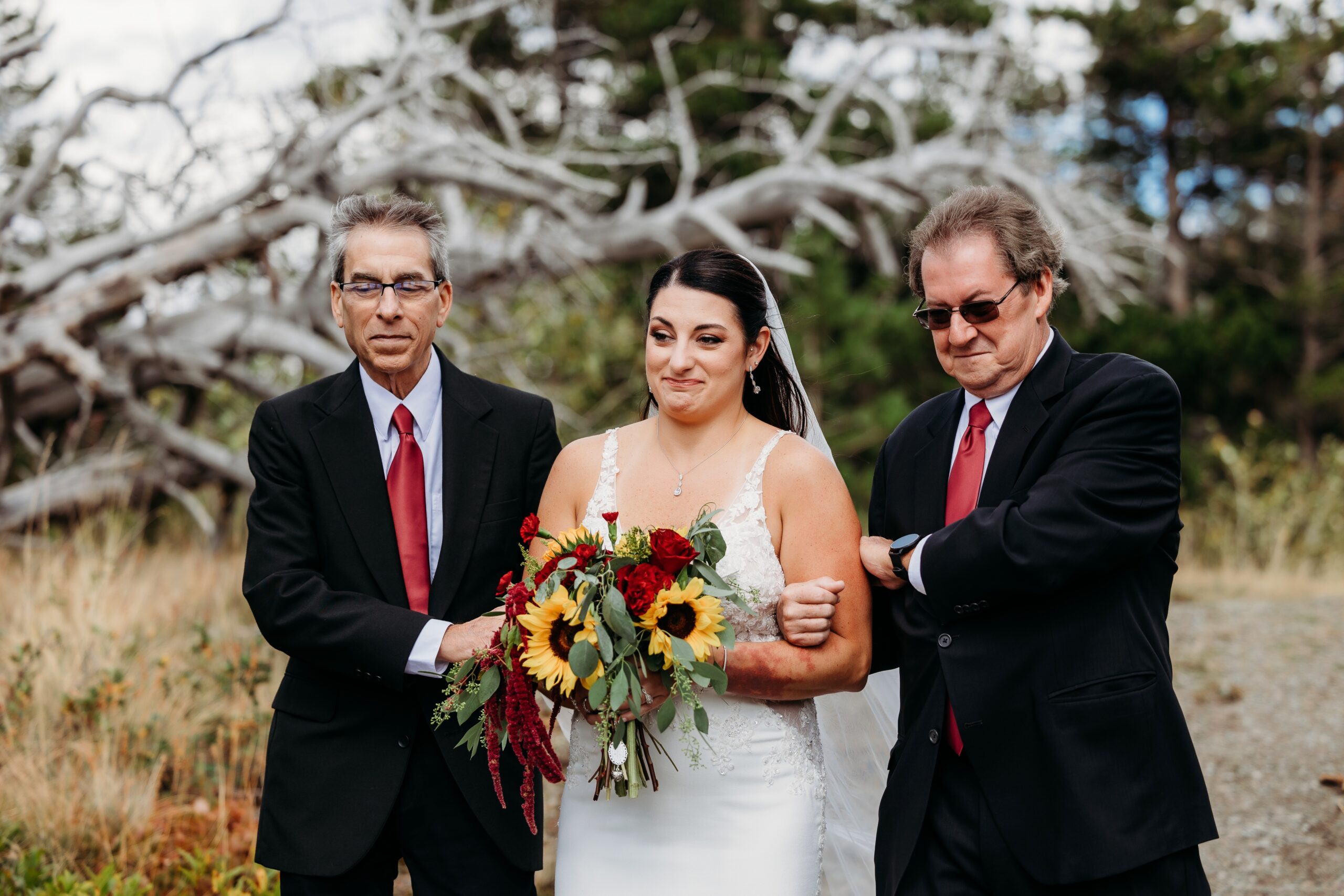 bride is walked down aisle by two men