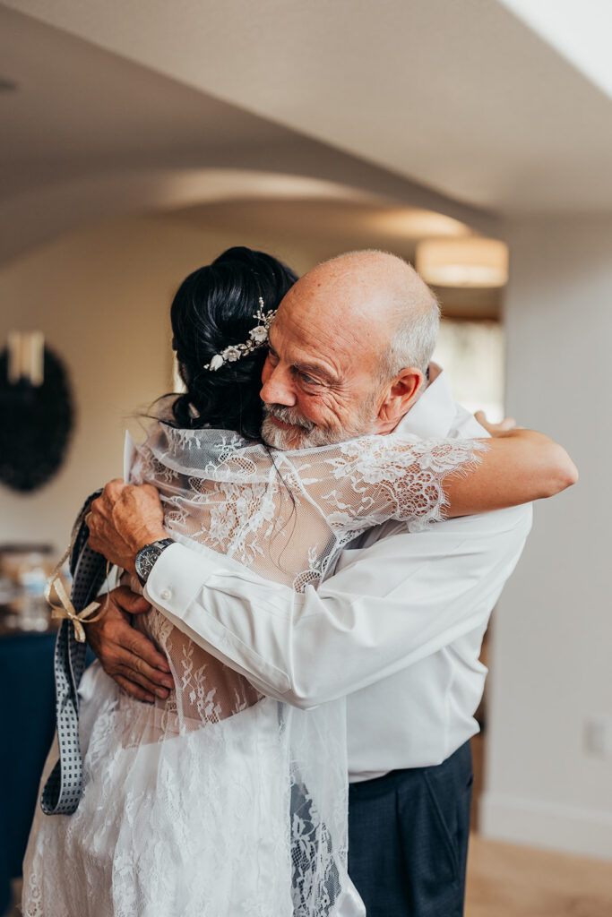 bride hugs older man