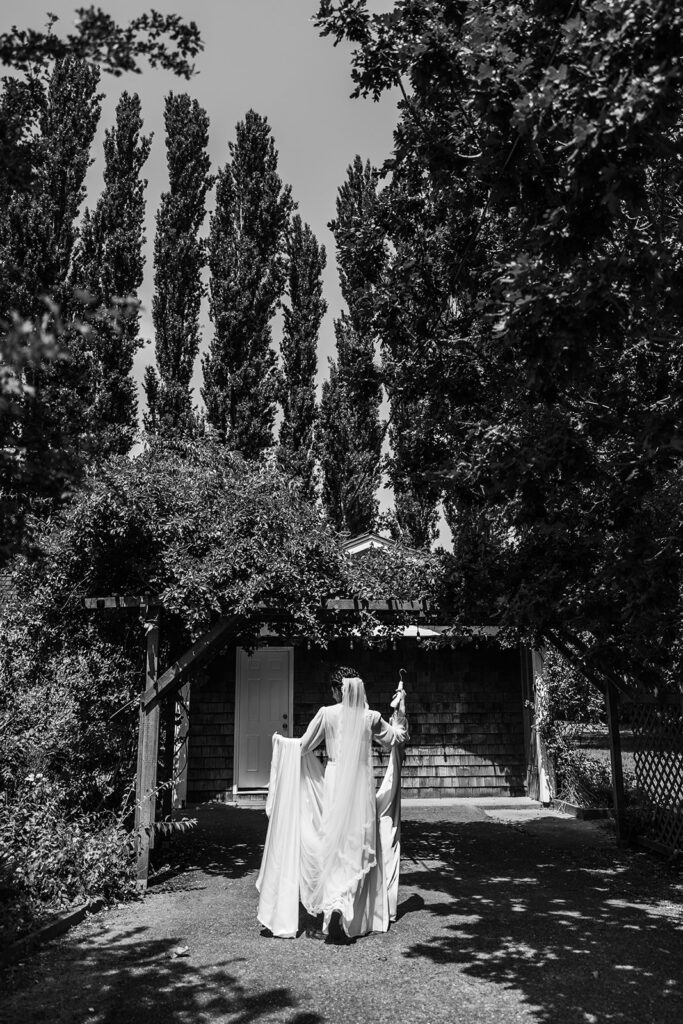 bride walks towards building