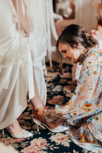woman puts bride shoes on