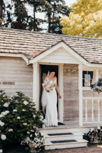 bride exits cute cottage
