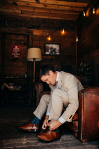 groom puts on his shoes