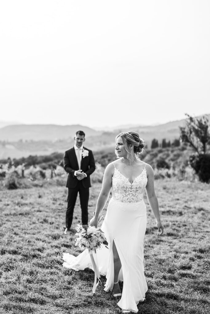 bride walks away from groom in front of field