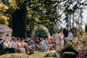 wedding ceremony in rose garden at christiansons nursery