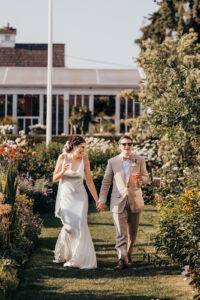 bride and groom walk into reception