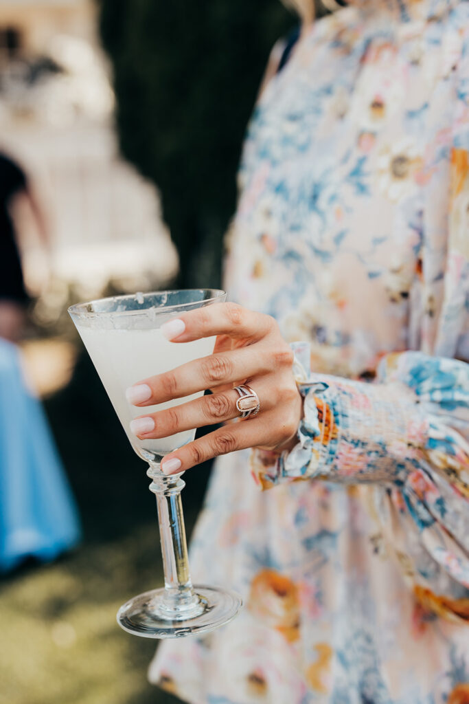 woman holds cocktail